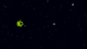 space, with many small colored stars and some irregular nebulae/galaxies in the foreground